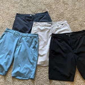 Quantity of 4 Travis Mathew shorts size 32.
